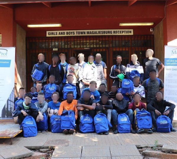 MaxProf's visit to the Girls and Boys Town to deliver backpacks and stationery sets