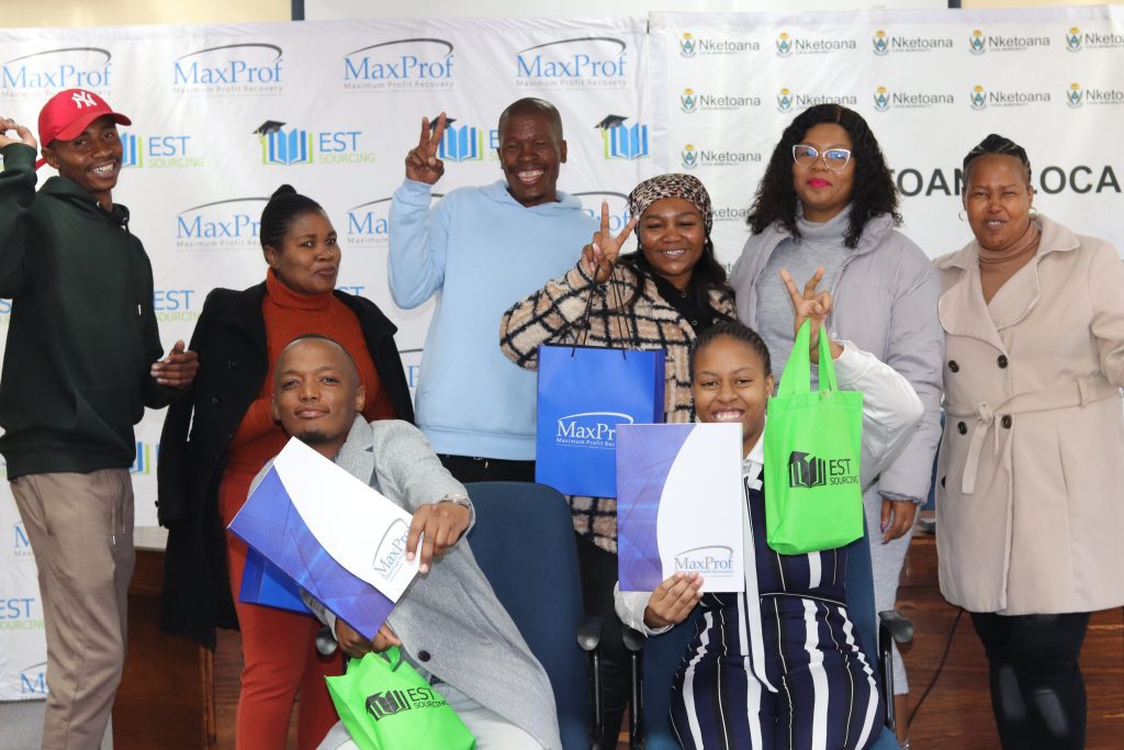 Bursary Recipients Paballo Motaung and Kamohelo Makhalemele with Councillor Koos Mofokeng.