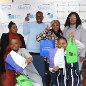 Bursary Recipients Paballo Motaung and Kamohelo Makhalemele with Councillor Koos Mofokeng.